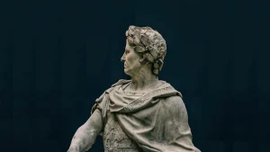 Close-up of a marble statue depicting a classical historical figure with intricate details.